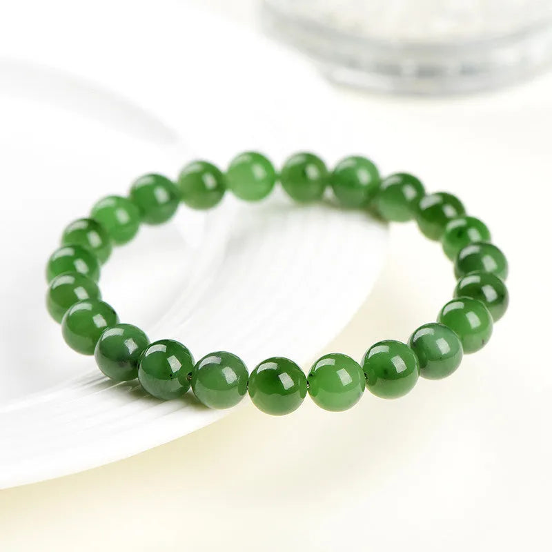 Natural Jasper bead bracelet with polished Russian Jasper beads in multiple sizes on a white background.