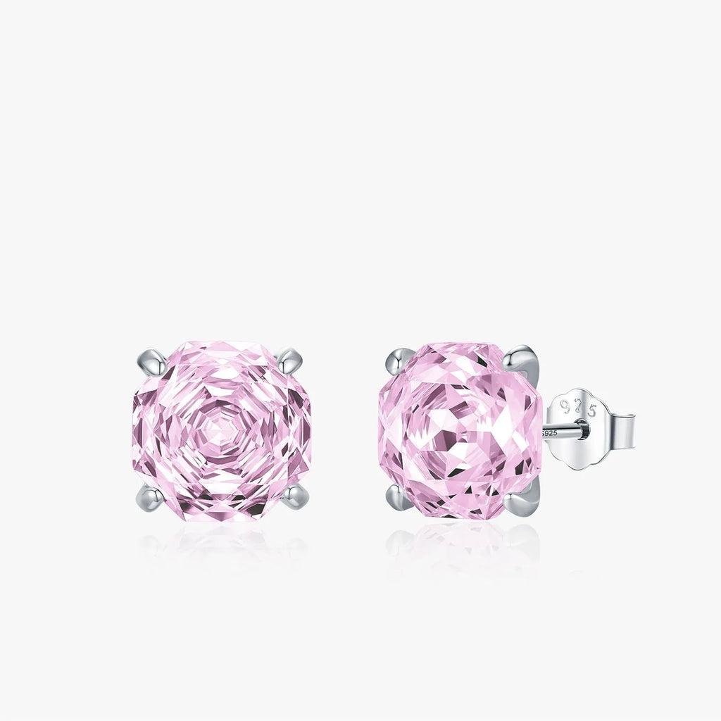 Close-up of a pair of pink S925 sterling silver rose-shaped stud earrings on a plain background.
