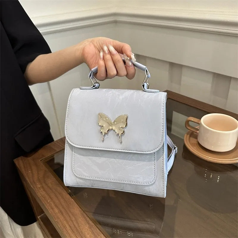 Women's PU leather backpack in multiple colours with bow detailing and hand-carrying option