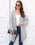 Brown loose-fitting acrylic sweater coat for women on a hanger.
