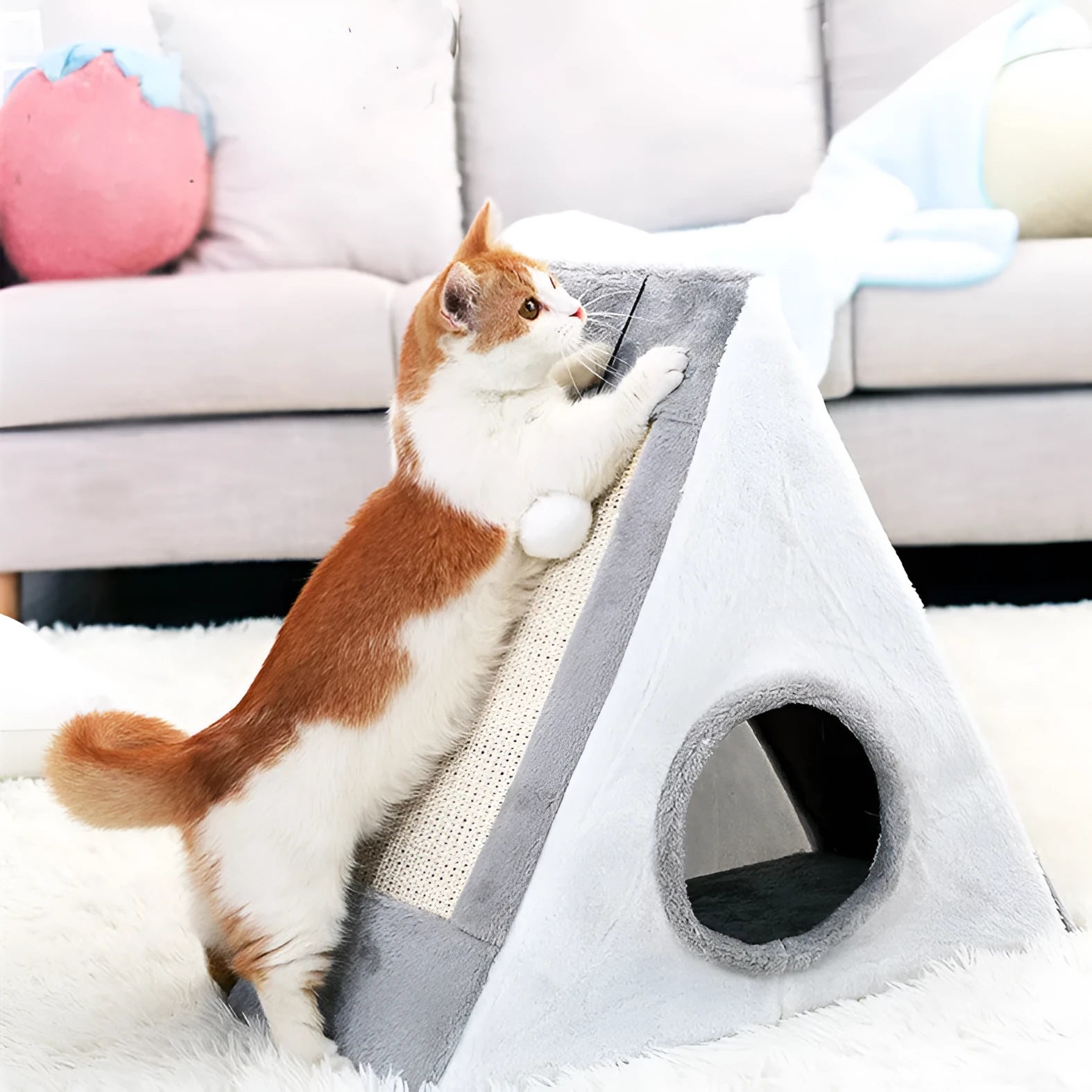 Grey and white triangle cat scratching post with integrated plush bed for cats.