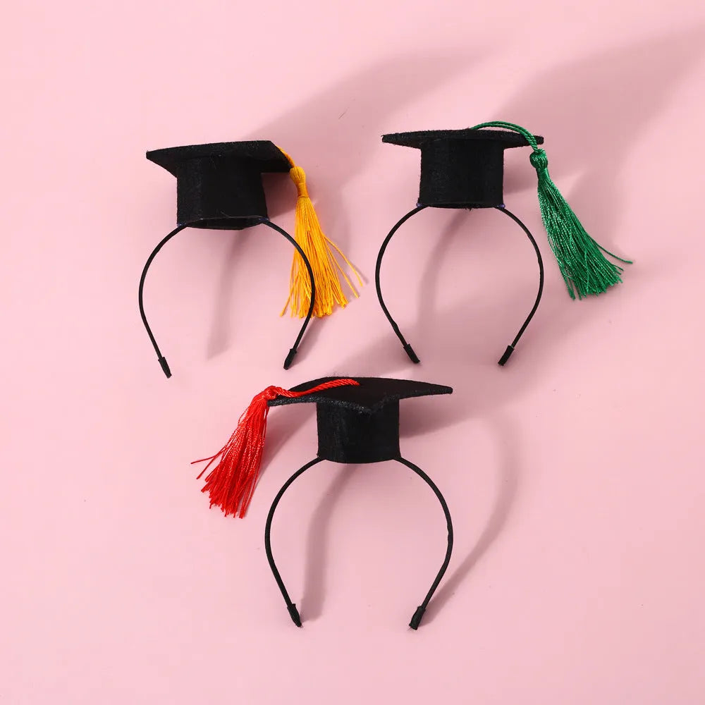 British-style pet hair band and bow tie set in four colour options on a mannequin head.