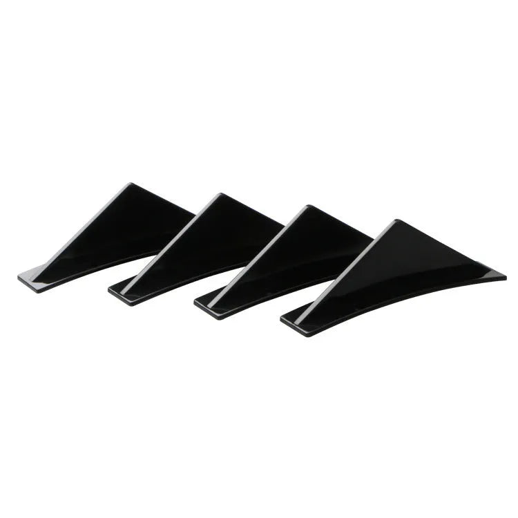 Four 150mm triangular ABS car rear spoilers on a bright black and carbon fibre background.
