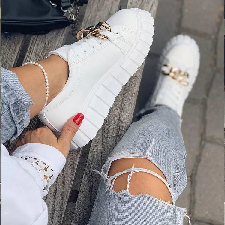Low-top flat casual sneakers in artificial PU with rubber sole and front lace closure
