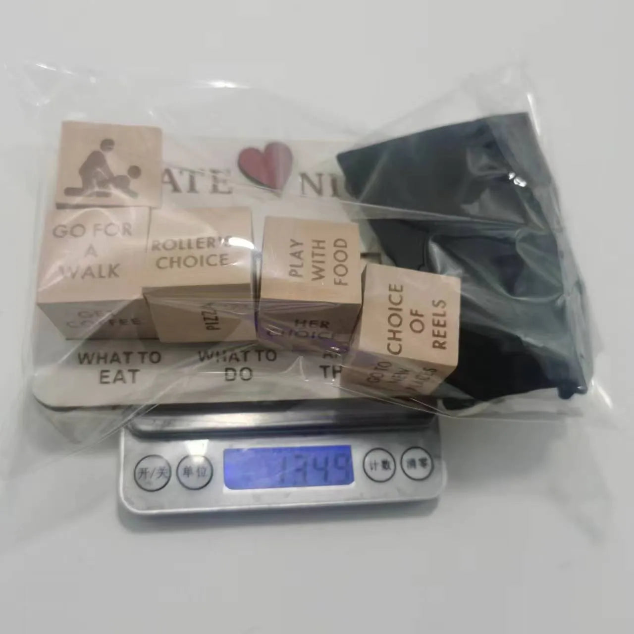 Wooden date night dice set showing five dice, date planner board, and black storage bag for couple's activities