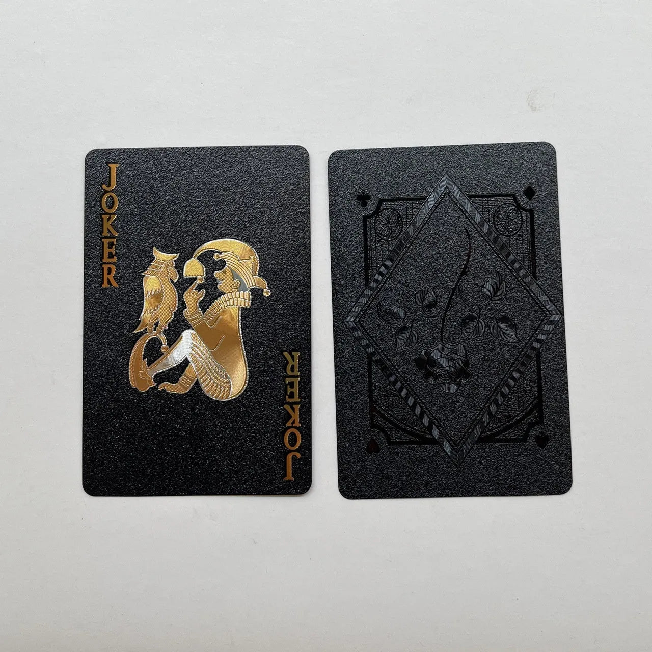 Four gold foil playing cards with rose and gold designs showing Tuhao gold, gold rose, silver rose, and black rose patterns
