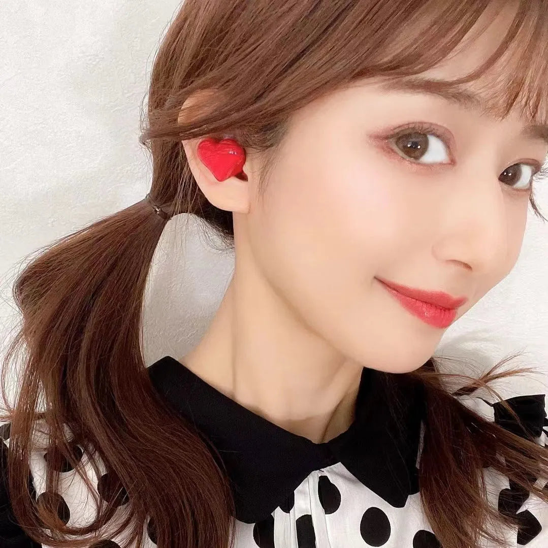 Heart-shaped wireless Bluetooth headphones in Chinese red colour with charging cable