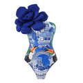 Blue one-piece swimsuit with matching sheer gauze cover-up dress set for women on holiday.