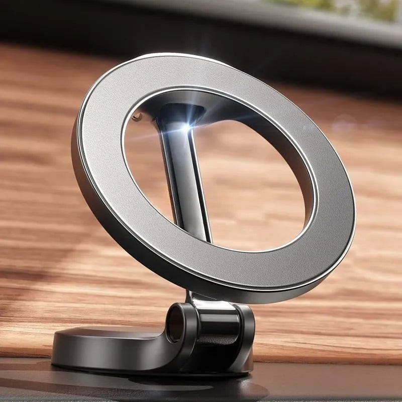 All-metal magnetic car phone mount with foldable arm in Qian colour on a car dashboard.