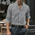 Man modelling a loose-fit khaki striped long sleeve casual button shirt.