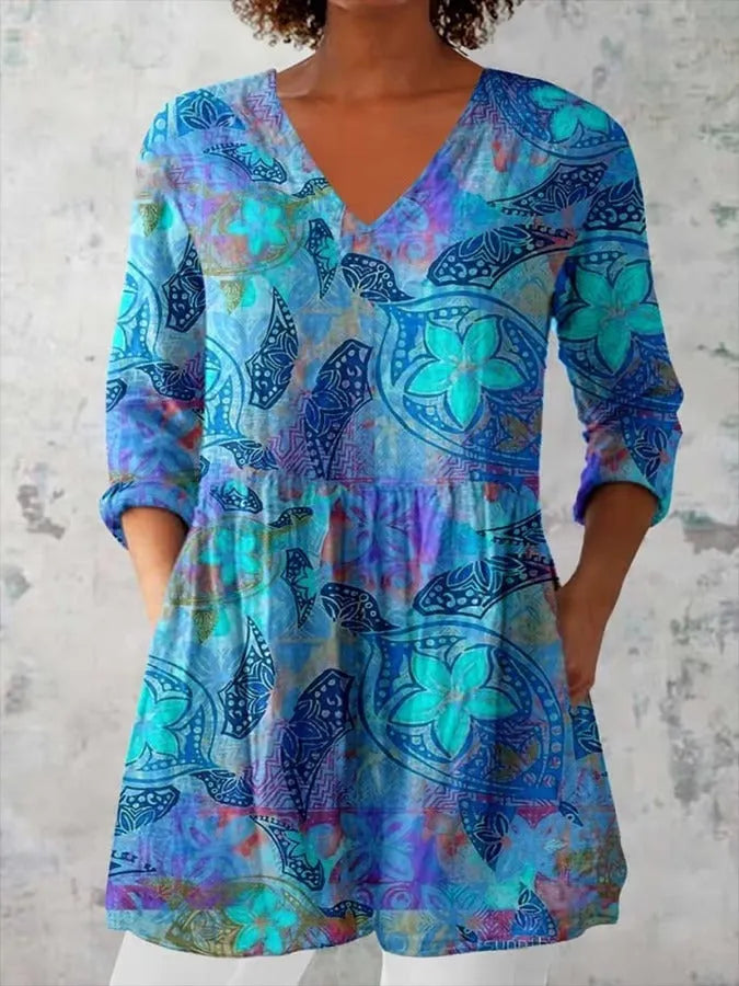 Women wearing a retro-style slim fit long-sleeved top with a digital print pattern.