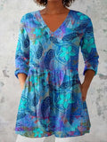 Women wearing a retro-style slim fit long-sleeved top with a digital print pattern.