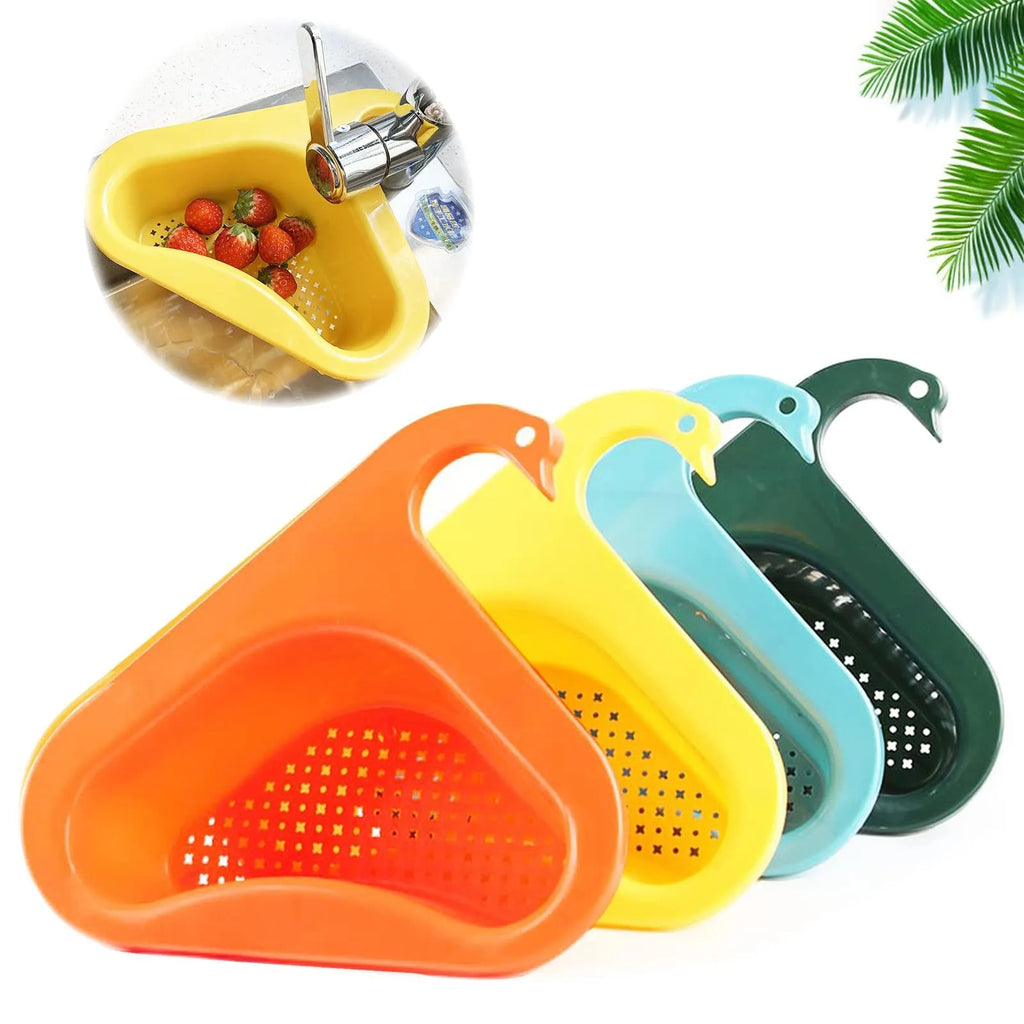 Blue plastic swan-shaped basket hanging over a kitchen sink edge to drain fruit and vegetables.