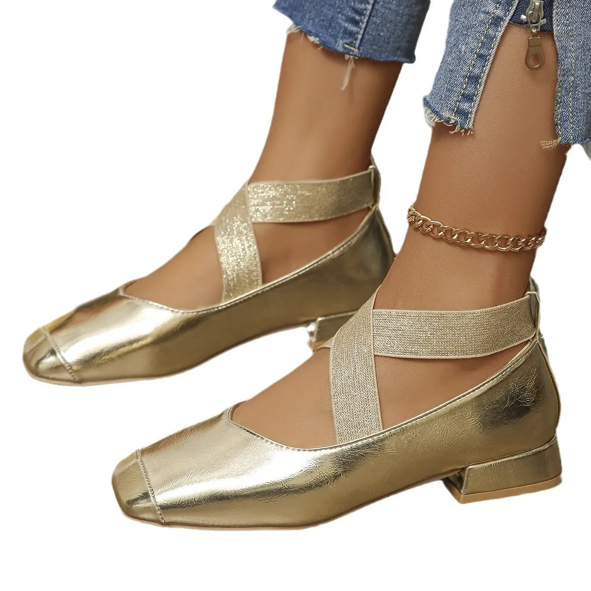 Gold slip-on evening pumps with a square toe and low heel on a plain background.