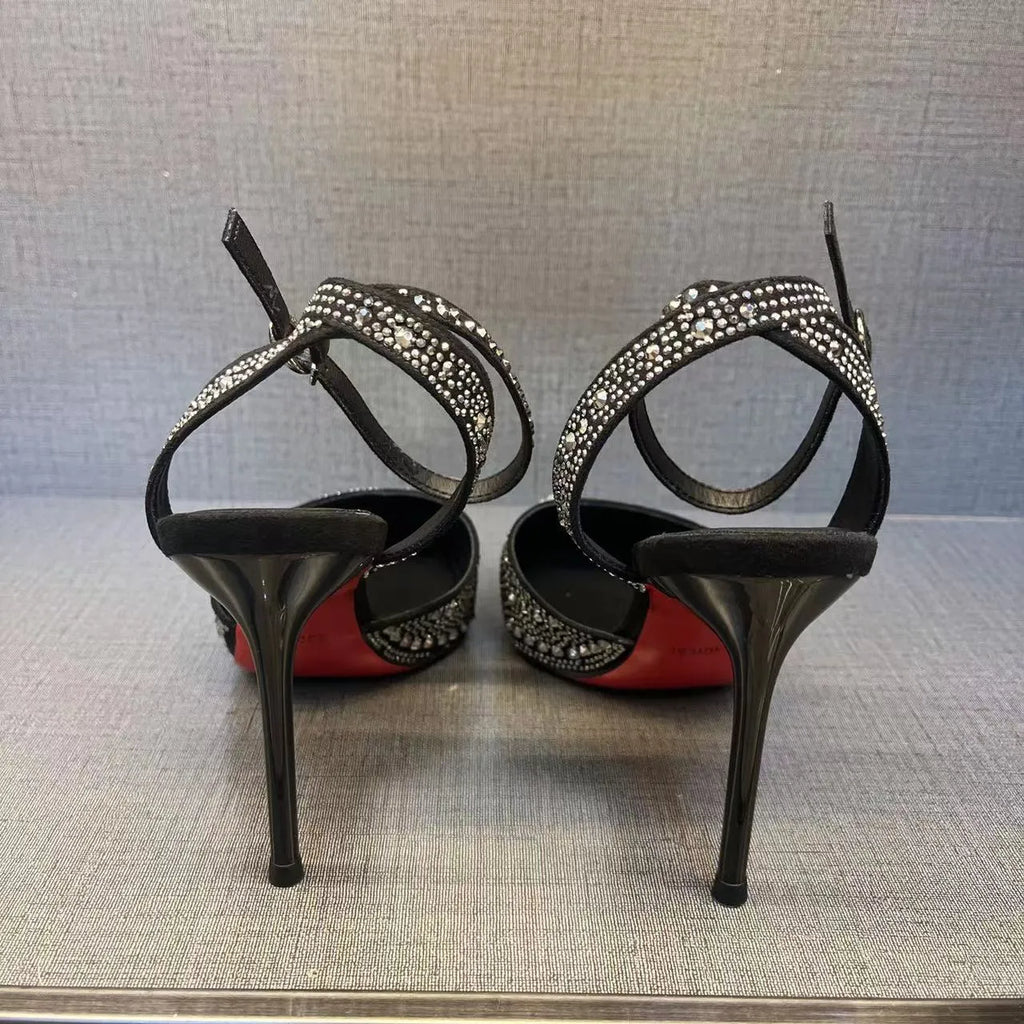 Women's silver hollow high heels with red sole and pointed stiletto heel.