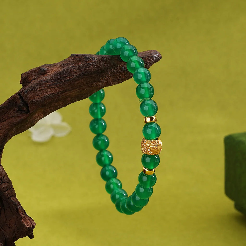 Green agate and sterling silver bracelet with yellow gold plating and 6mm geometry beads.