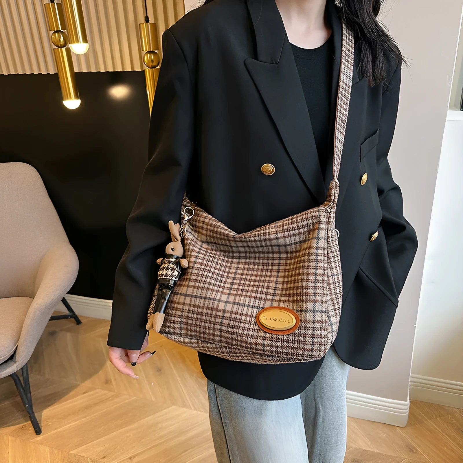 Women's woolen shoulder bag in horizontal square shape with cross-body strap and decorative sewing lines