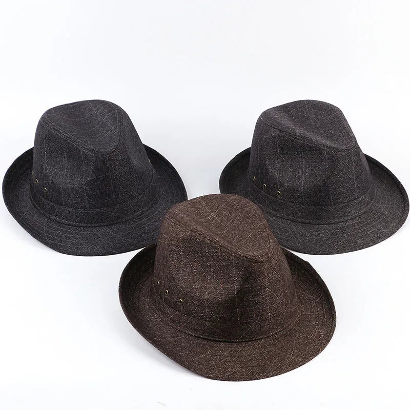 Classic brown fedora hat with pinched crown and 6cm brim, shown on a wooden table.