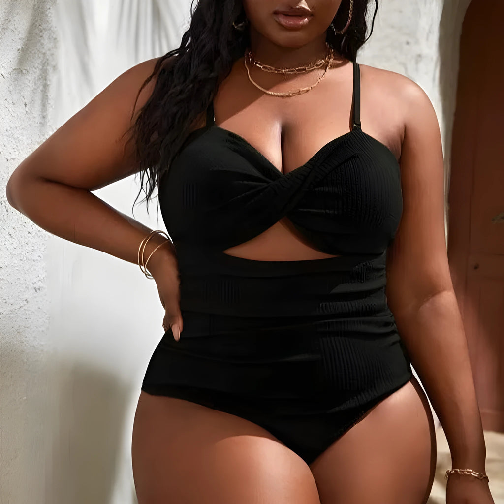 Plus size women's black sling triangle one-piece swimsuit with polyester and spandex stretch fabric