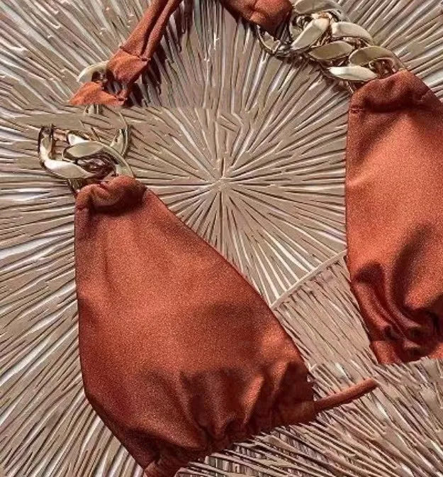 Brown women's tube-top bikini with adjustable metal rings on the back and a split-leg bottom.
