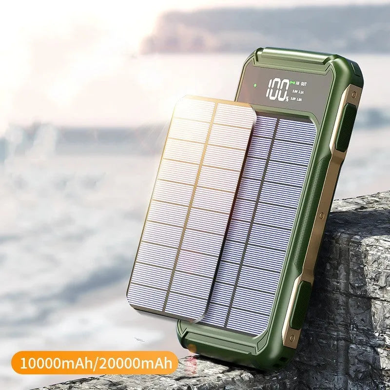 Military-grade mobile power bank in black, green, or orange, showing compact size next to a smartphone for scale.