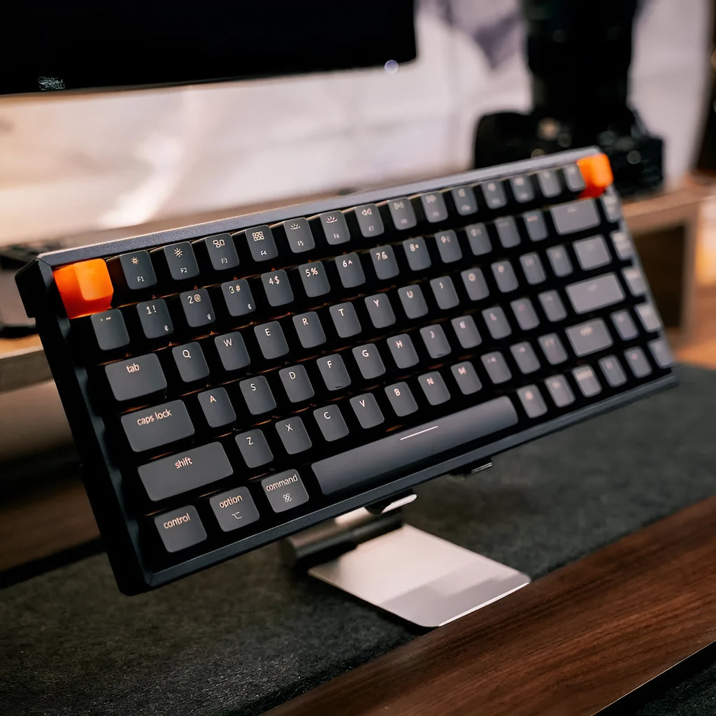Plastic edge 87-key mechanical keyboard with white LED backlighting, grey colour, showing keycaps and USB cable