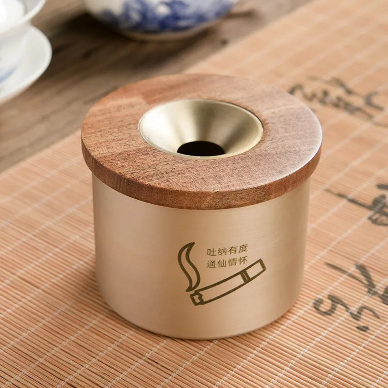 Retro brass ashtray with wooden lid in copper construction for living room use