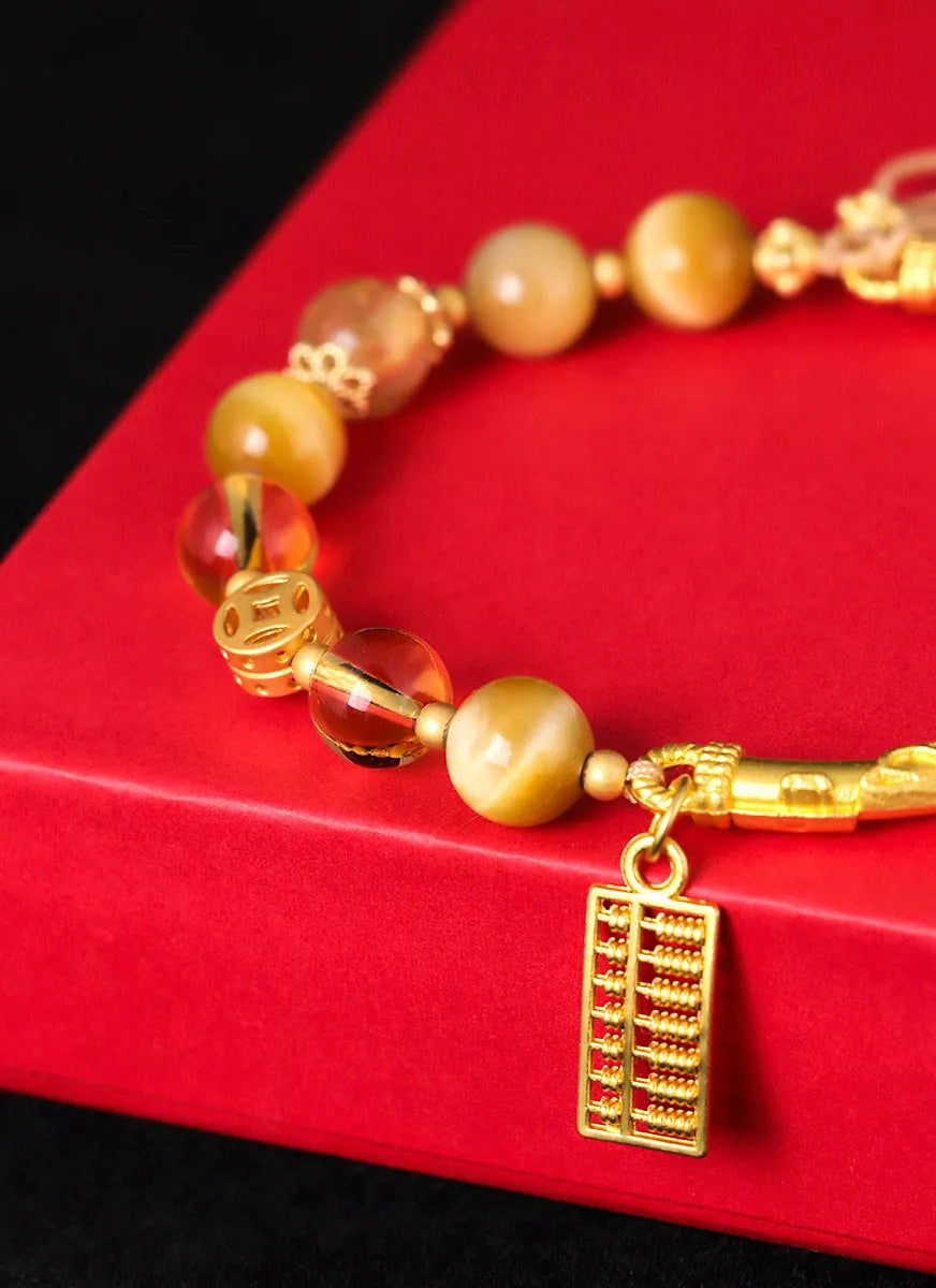Tiger eye and citrine beaded bracelet with yellow crystal and diamond-shaped copper parts for women