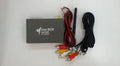 Black car mirror link box with power cable, AV cable, antenna, and user manual.