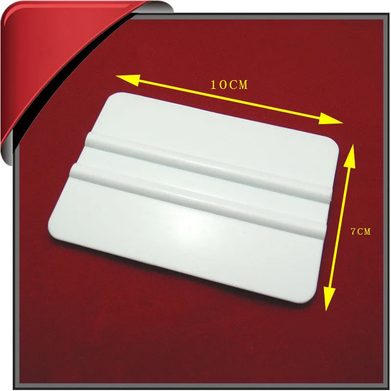 Blue automotive film scraper made from PP plastic, measuring 125x80mm, designed for car decal removal
