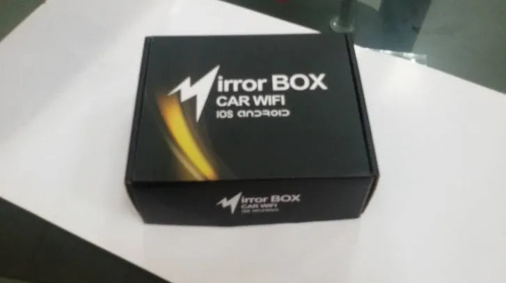 Black car mirror link box with power cable, AV cable, antenna, and user manual.