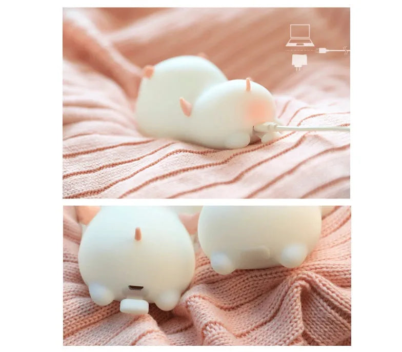 Blue or pink pig silicone night light with sleeping design, shown with dimensions and rechargeable battery.
