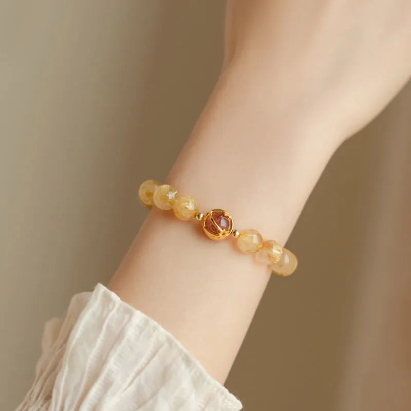 Natural citrine and gold rutilated quartz crystal bracelet with diamond-shaped beads