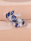 Adjustable copper leaf-shaped ring with a central horse eye zircon stone, shown in a rose gold finish.