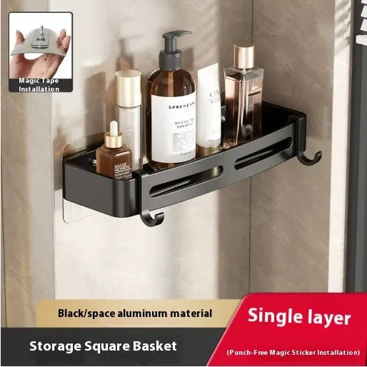 Gun Gray metal corner storage rack mounted on a bathroom wall, holding toiletries.