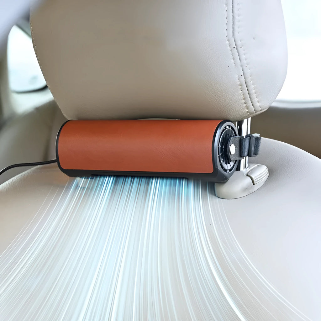 Compact black USB-powered car rear seat fan with a long cable on a car seat.