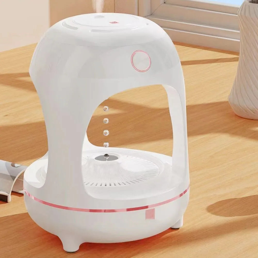 Rose gold and white columnar humidifier with levitating water drops and LED lighting on desk