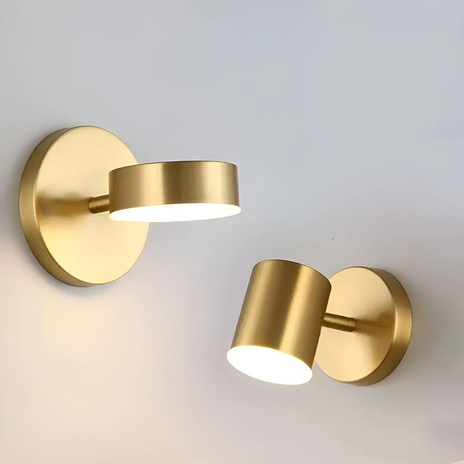 Rotatable bedside wall lamp with golden mirror front in gold finish mounted on wall