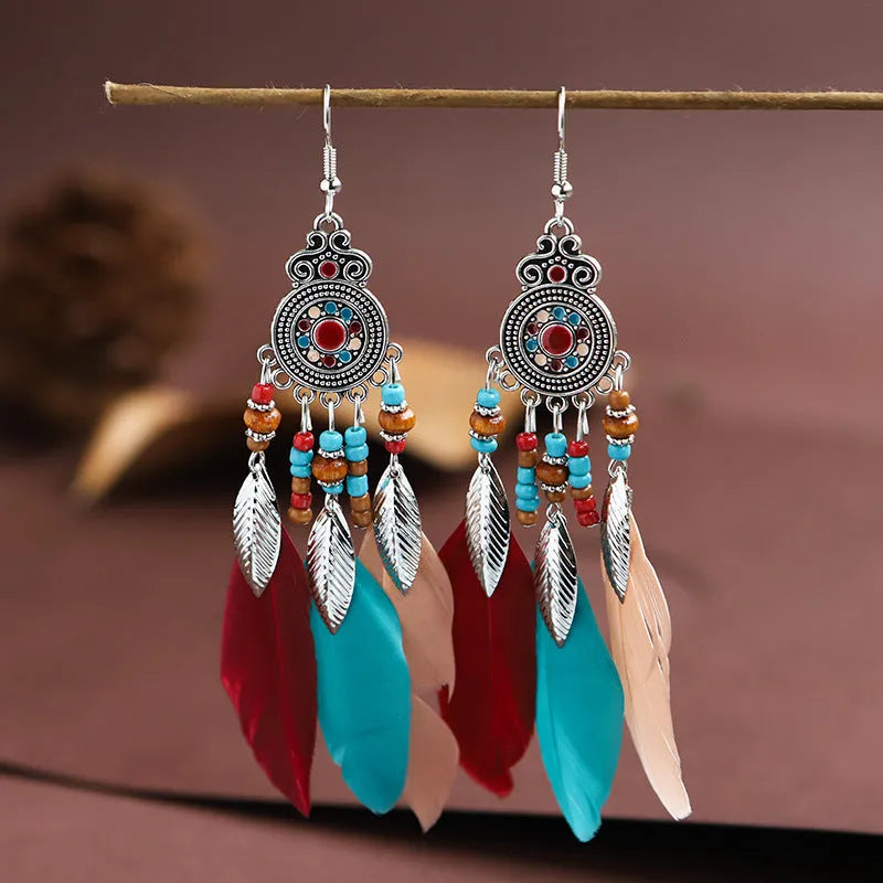 Bohemian style round drop feather earrings with leaf design in alloy, showing electroplated finish.