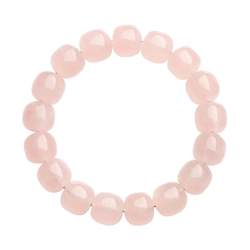 Pink natural bamboo crystal bracelet with geometric barrel beads on a wrist.