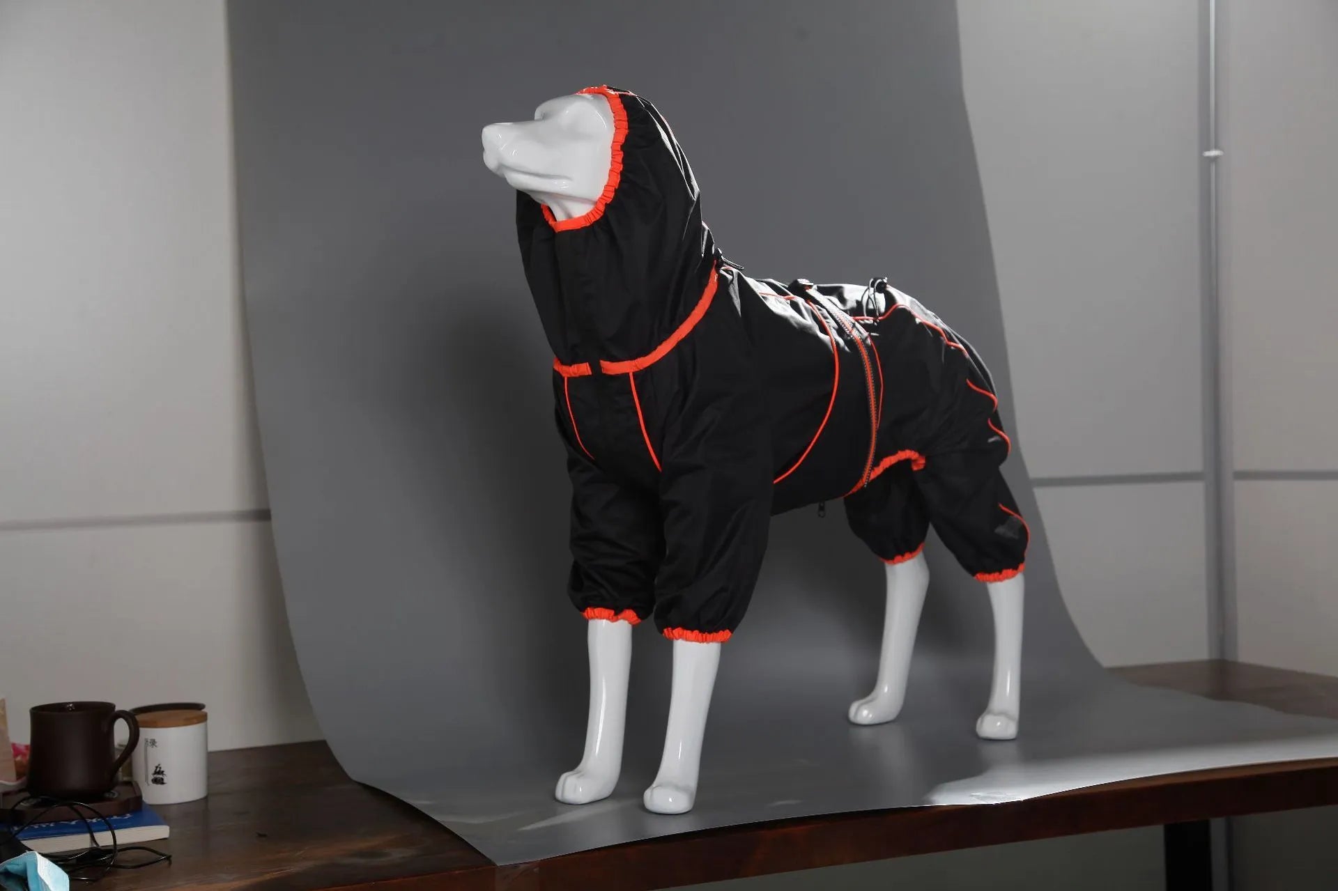 Red polyester dog shell jacket with cotton-padded insulation on a medium-sized dog outdoors