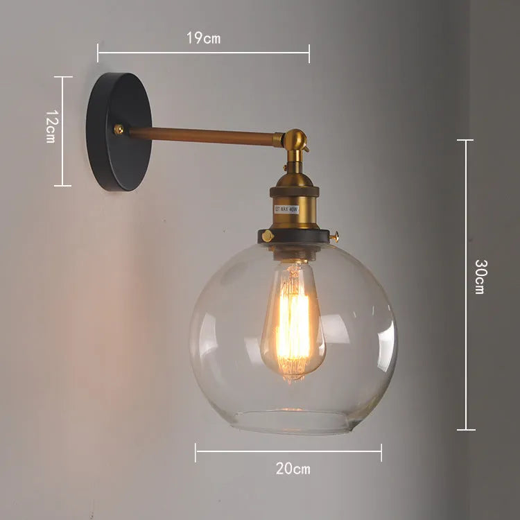 20cm diameter retro spherical glass wall lamp in amber, smoky grey, or transparent with aluminium holder.