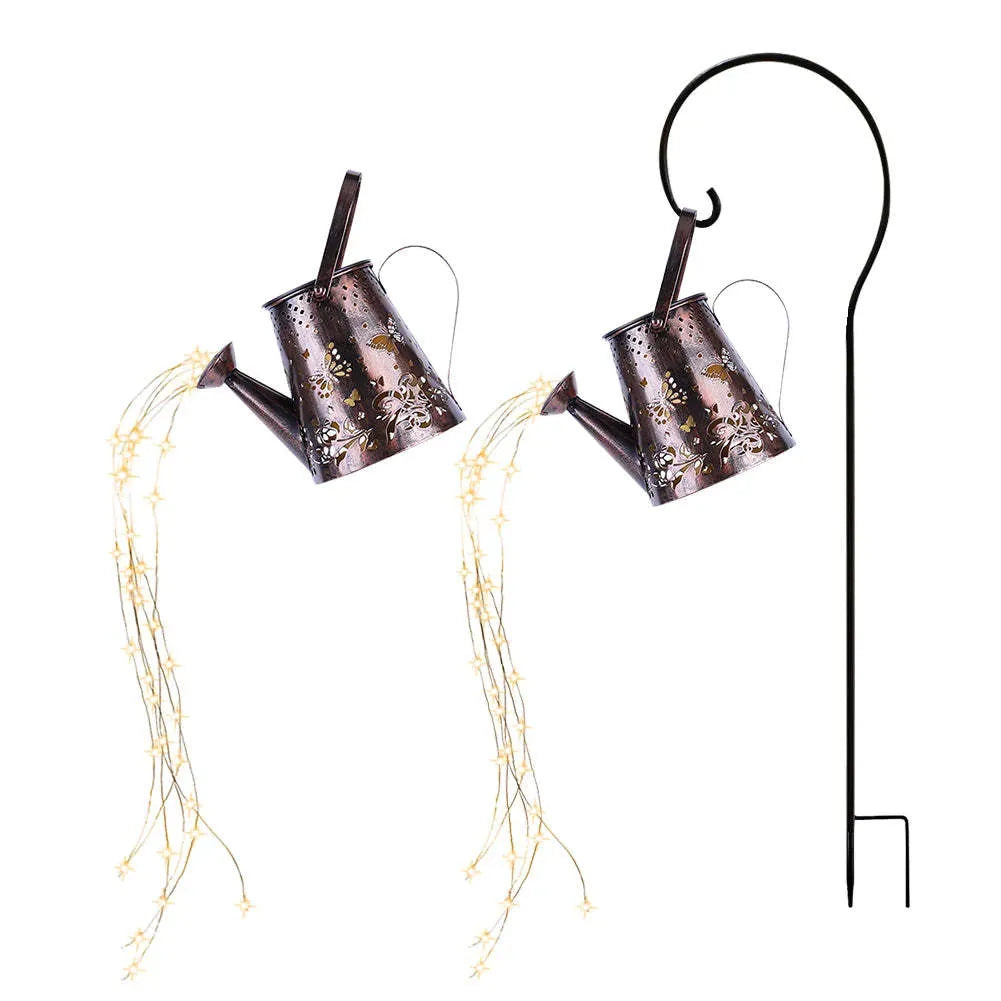 Tapered butterfly pattern iron solar garden lamp emitting warm white light