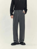 Black and grey loose straight-leg business casual trousers on a hanger, showing draping fit.