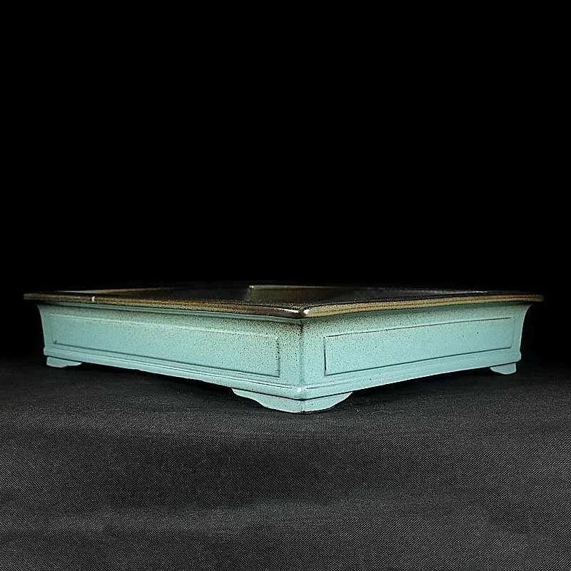 Green handmade ceramic bonsai flower pot with a retro purple sand crackled glaze.