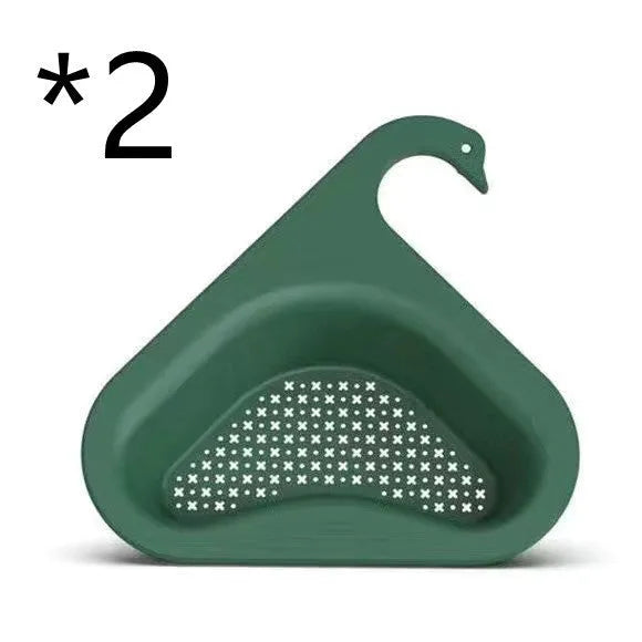 Blue plastic swan-shaped basket hanging over a kitchen sink edge to drain fruit and vegetables.