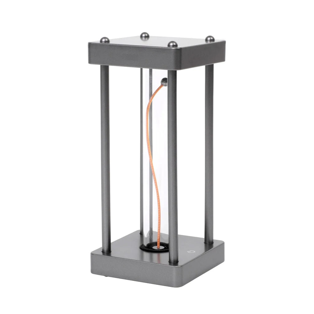 Metallic gray acrylic square night lamp with curved wire on a desk