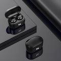Black in-ear stereo Bluetooth wireless headset with silicone ear tips displayed on a dark background.