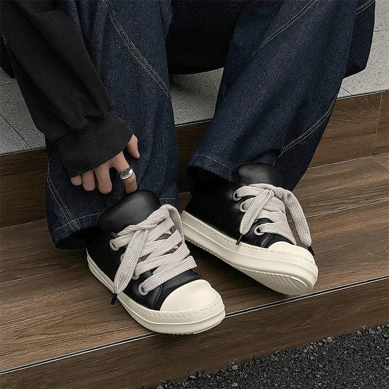 Black men's slip-on casual shoes with leather upper and rubber sole showing round toe and flat heel