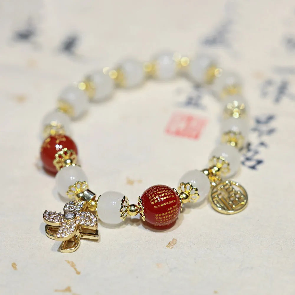 Chinese-style glass bracelet with coloured glaze, fu character, safety lock, windmill and bamboo presages charm designs